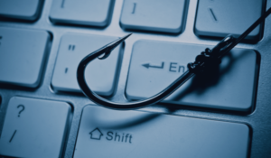 spear phishing and cyber insurance - keyboard with a fish hook