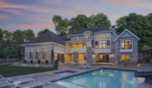 home insurance rates on the rise - large house with a pool